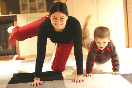 Mother and son doing pilates