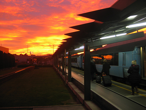 boarding a train at sunrise